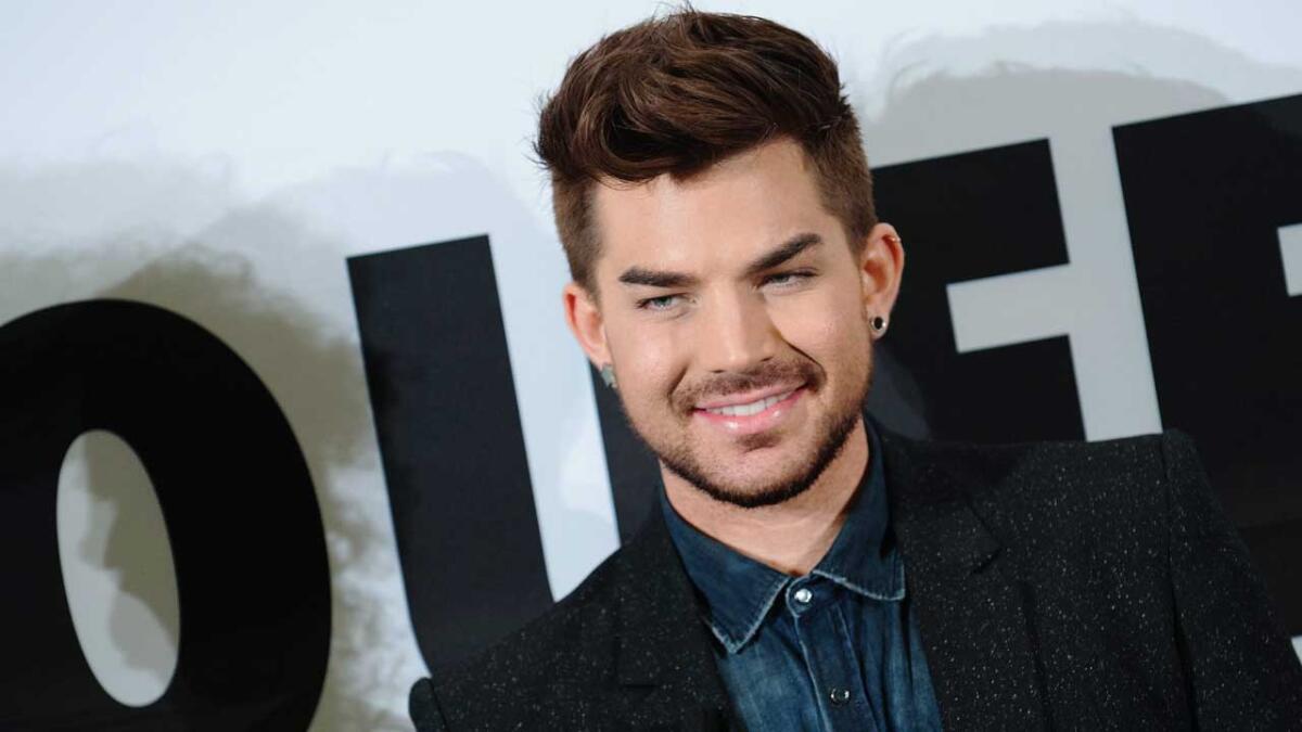 Queen can wait while Adam Lambert takes a seat at the judges' table on "American Idol."