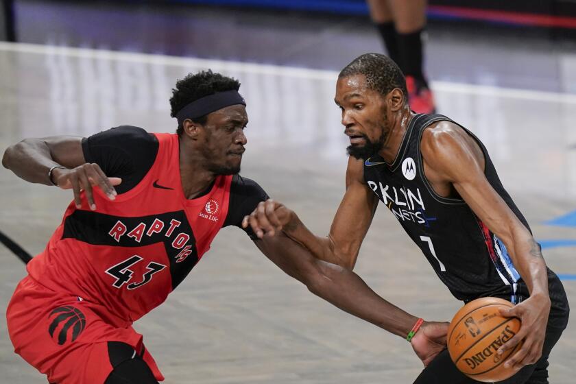 The Brooklyn Nets' Kevin Durant drives against the Toronto Raptors' Pascal Siakam on Feb. 5, 2021, in New York.