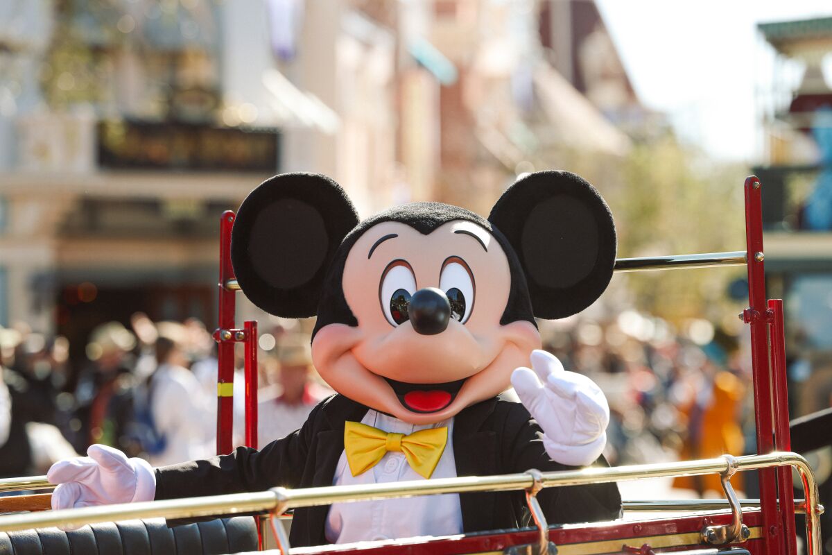 Mickey Mouse in a parade at Disneyland.