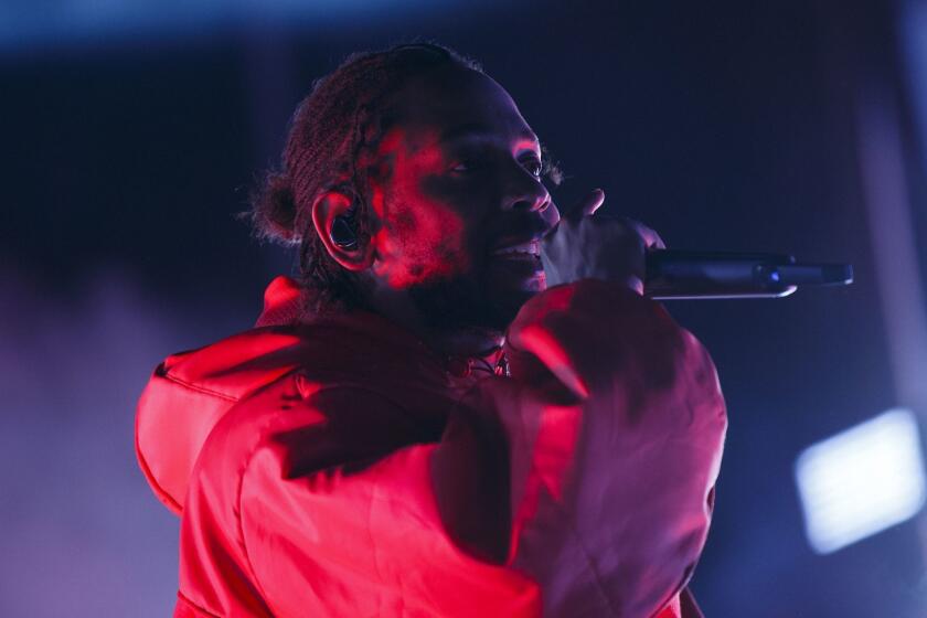 Artist Kendrick Lamar performs at L.A. Live during the NBA All-Stars weekend road show concert on Friday, February 16, 2018 in downtown Los Angeles, Calif. (Patrick T. Fallon/ For The Los Angeles Times)