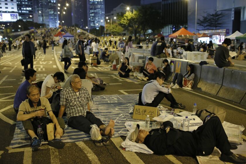 Protesters take a break Oct. 9 in the occupied areas of Hong Kong's central district.