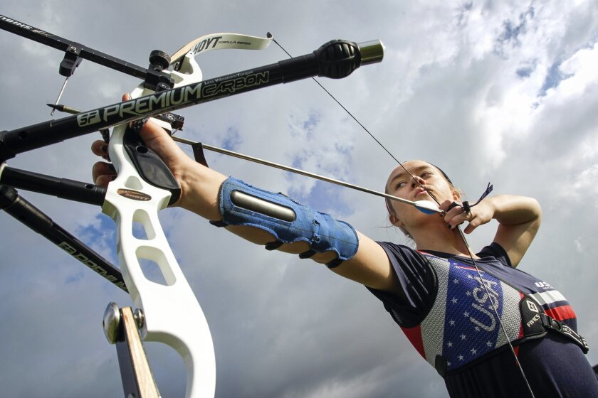 State champion archer Madison Devencenzi, 13, takes aim the target while she practices at the U.S. Olympic archery range in Chula Vista on Saturday.