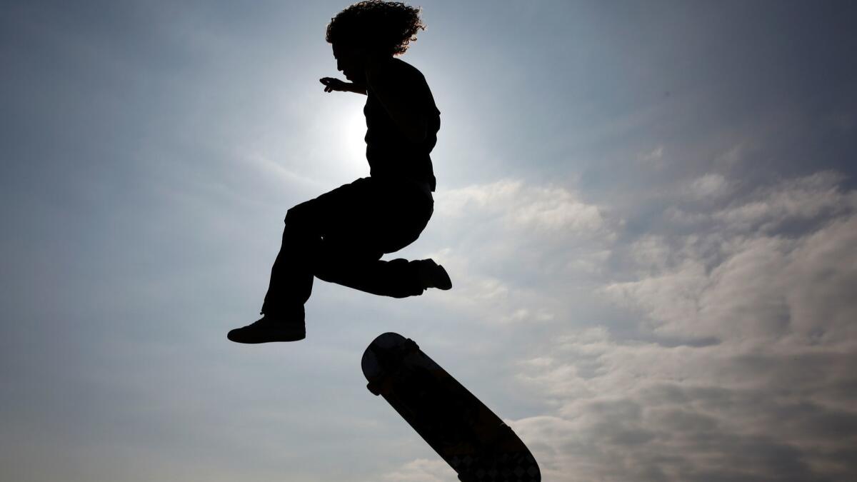 Ethan DeMoulin makes a jump at Venice Beach Skate Park.