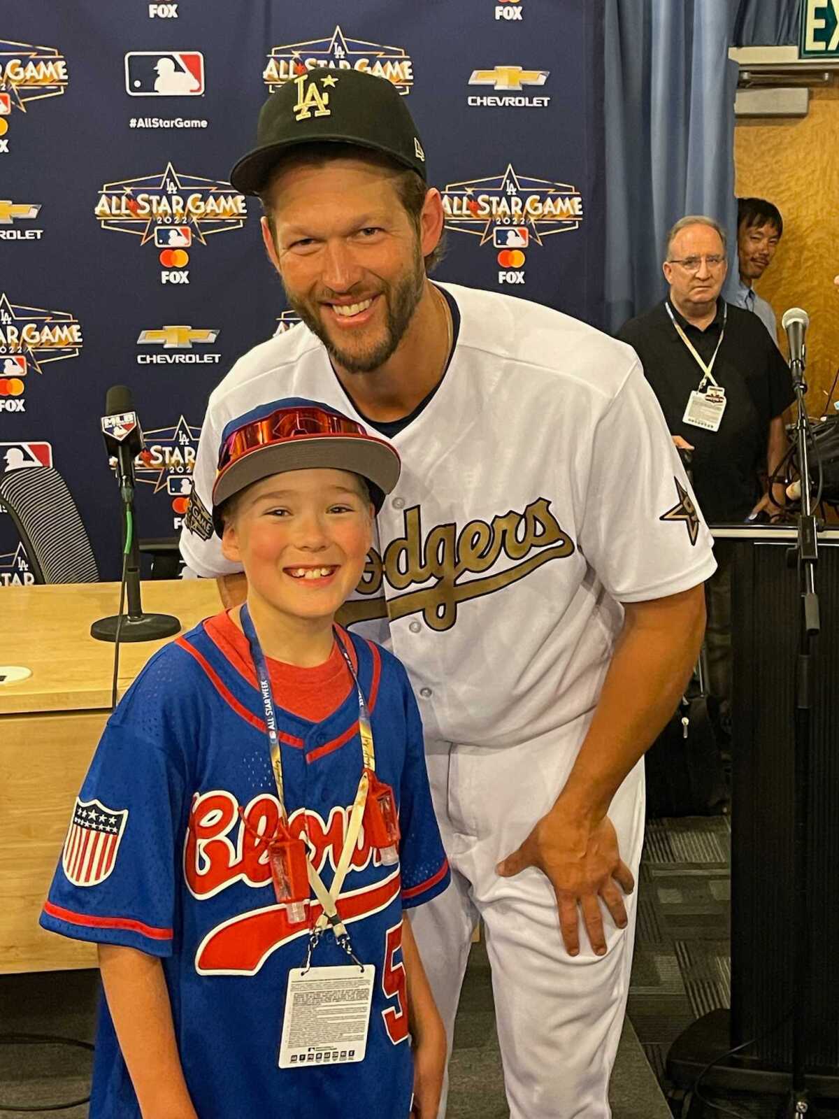 Clayton Kershaw and Blake Grice pose for a photo in a Dodger Stadium press conference room Tuesday.