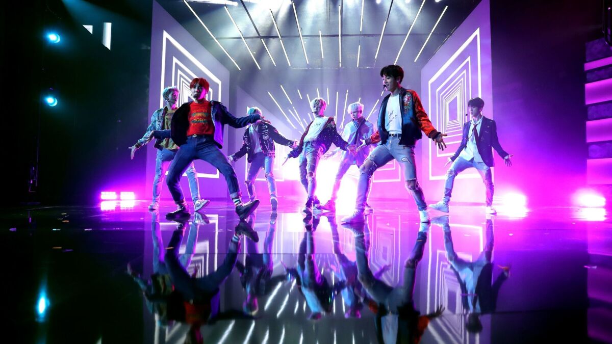 The Korean boy band BTS performs "DNA" at Sunday's American Music Awards.