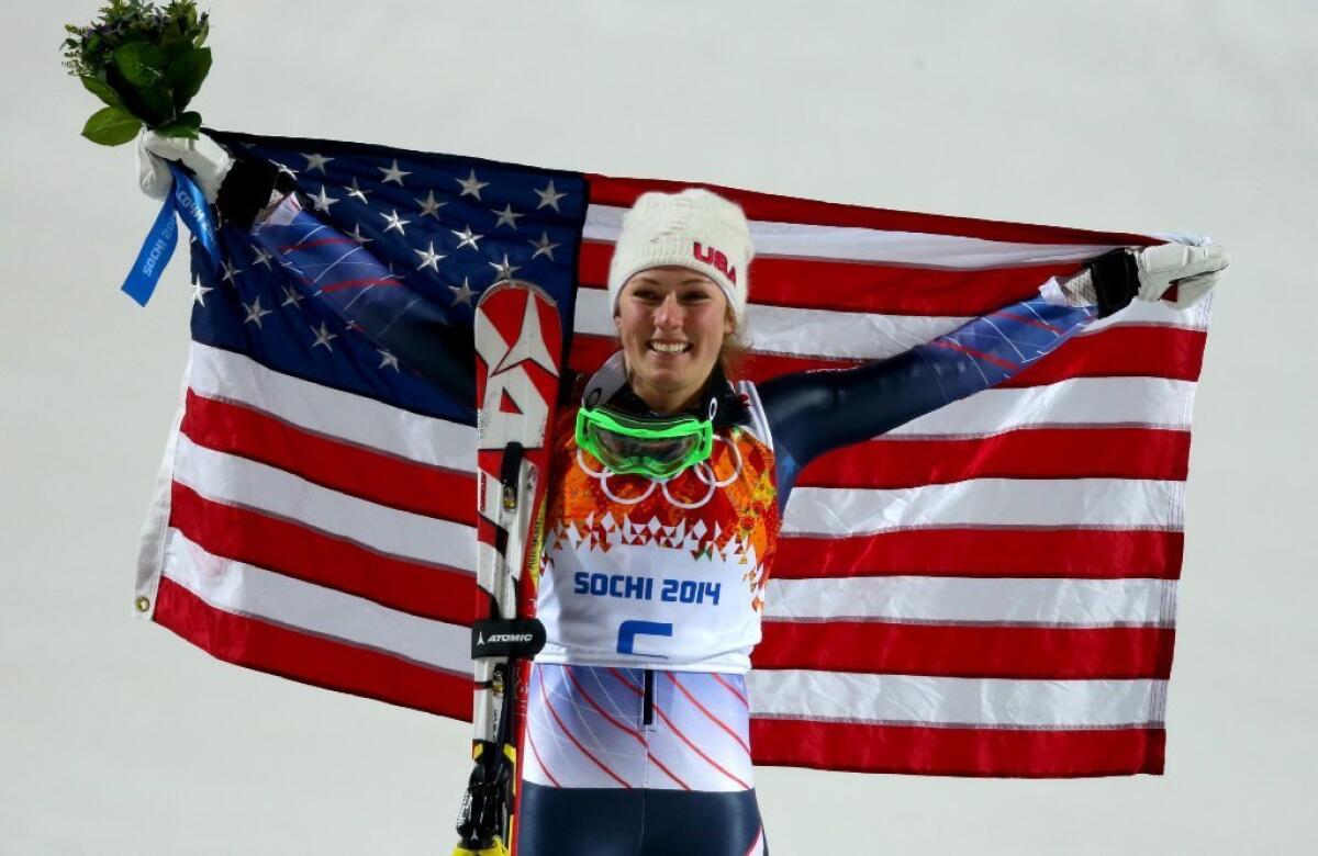 Mikaela Shiffrin celebrates her victory in the Olympic women's slalom competition.