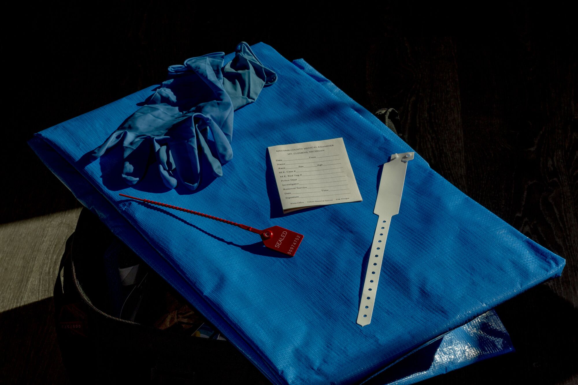 One of the blue body bags