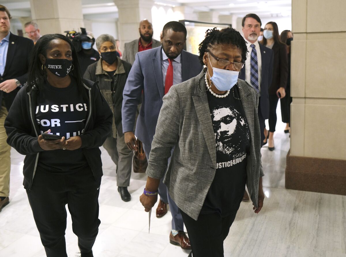 Madeline Davis-Jones, mother of death row inmate Julius Jones, makes her way to Oklahoma Gov. Kevin Stitt's office at the Oklahoma Capitol in Oklahoma City, Monday, Nov. 15, 2021. Supporters of Jones, including his mother, visited the state Capitol on Monday with hopes of meeting with Stitt. (Doug Hoke/The Oklahoman via AP)
