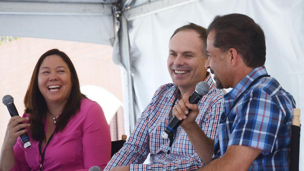 Jen Leo, John DiScala (Johnny Jet), center, and Gabe Saglie of Travelzoo talk about how to save money on travel at the Los Angeles Times Festival of Books on Saturday.