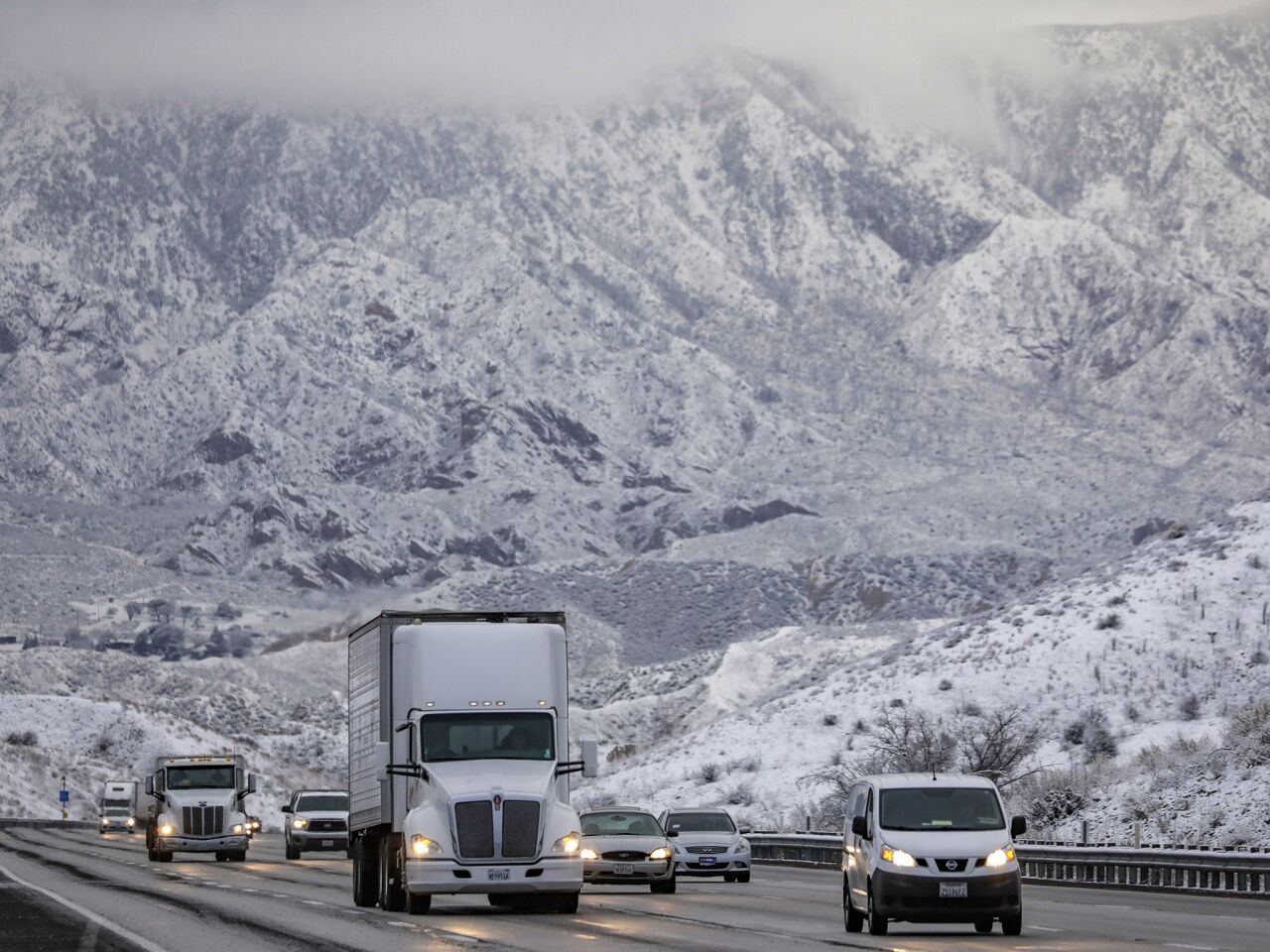 Traffic is running smoothly on Thursday morning through the snow-covered Cajon Pass.
