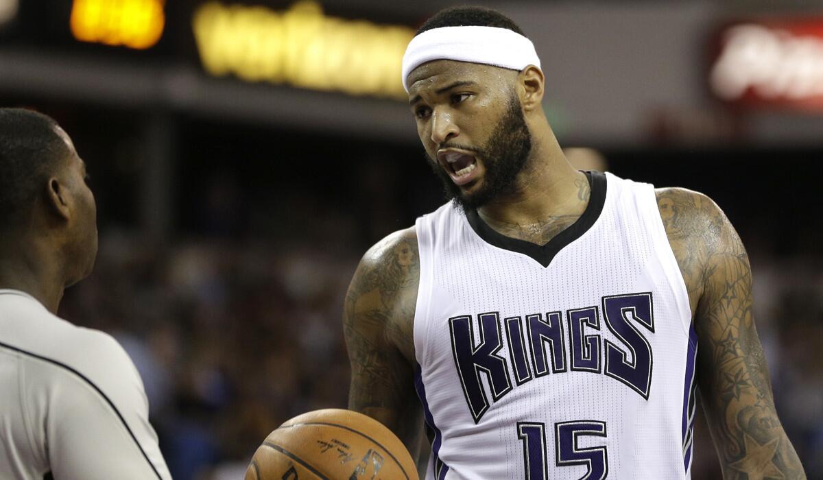 Sacramento Kings center DeMarcus Cousins, right, questions official James Williams about a call during the second half of a game against the Cleveland Cavaliers on Wednesday.