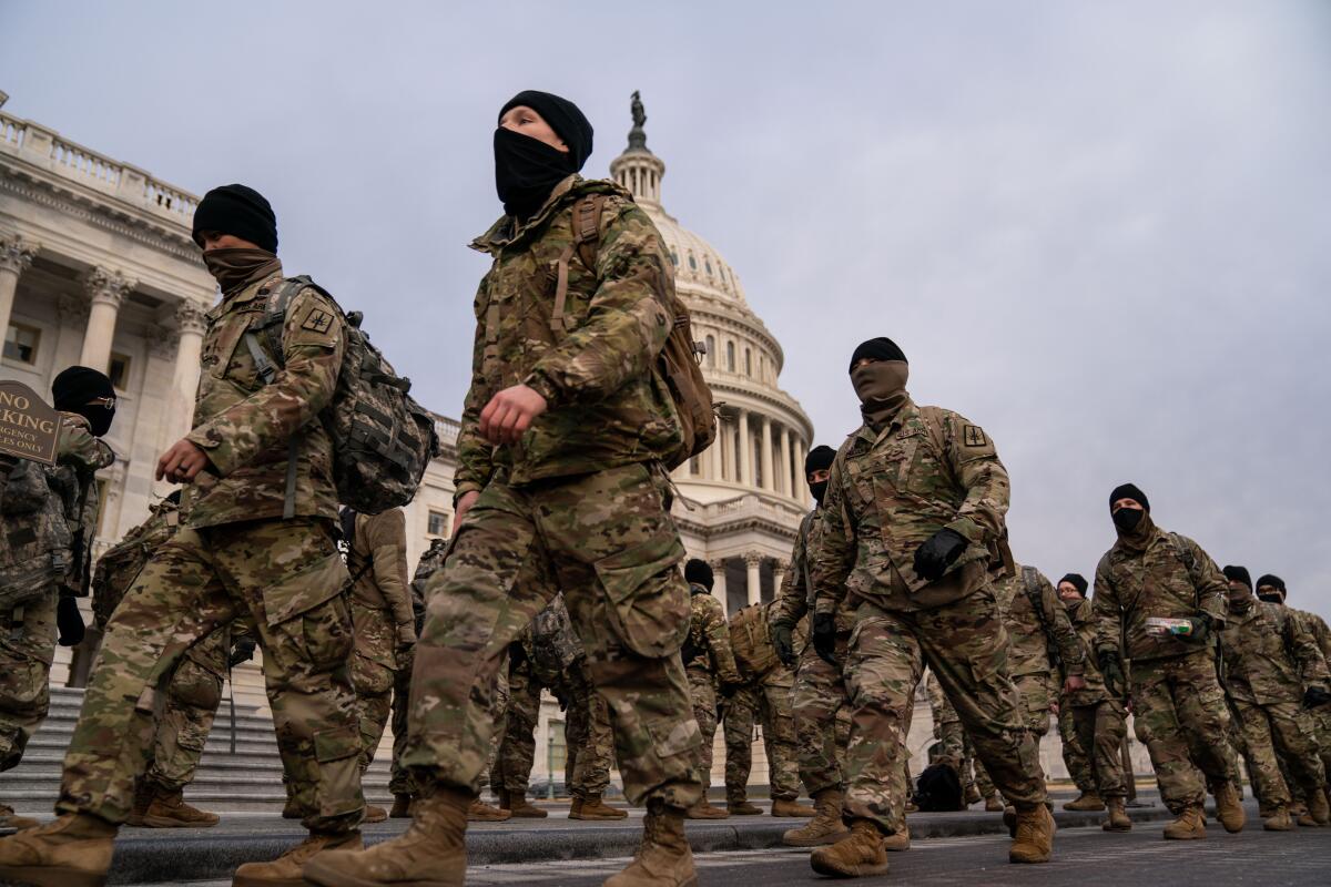 National Guard members gather Monday on the U.S. Capitol.