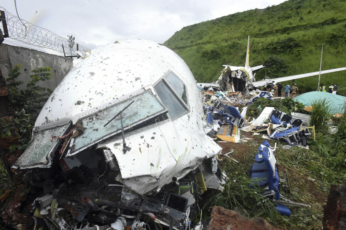 The wreckage of the Air India Express flight that skidded off a runway while landing in Kozhikode, India.