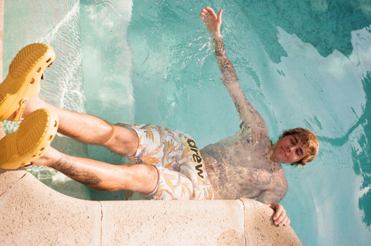 A photo of Justin Bieber wearing Crocs.