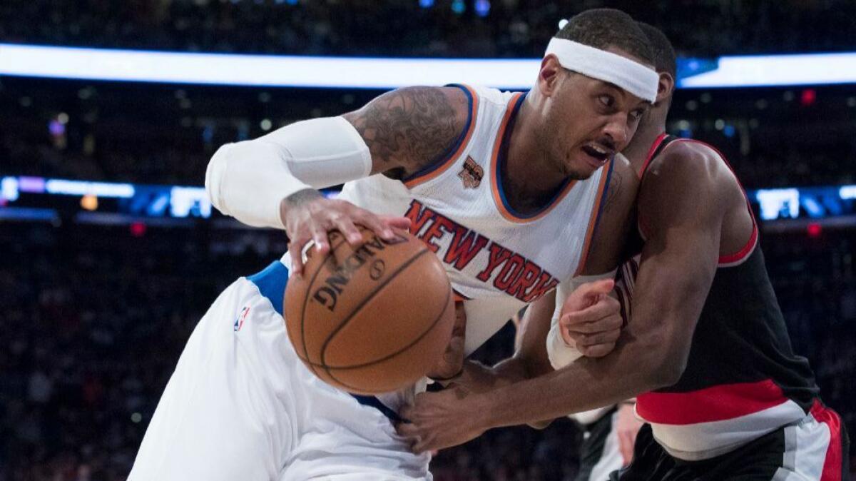 Knicks forward Carmelo Anthony drives to the basket against Trail Blazers forward Maurice Harkless during a game on Nov. 22.