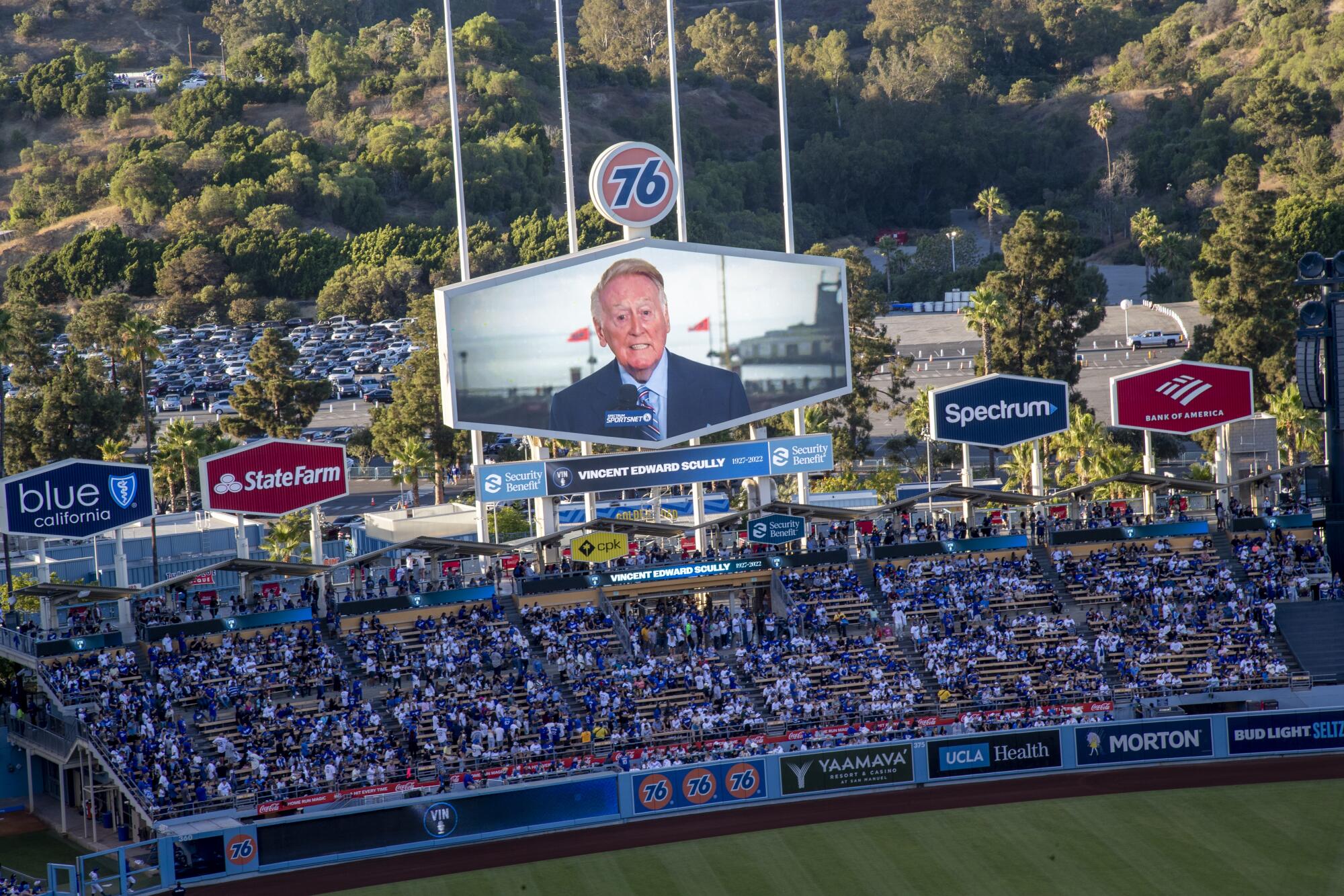 Vin Scully is shown on the left-field video board during a tribute to him. 