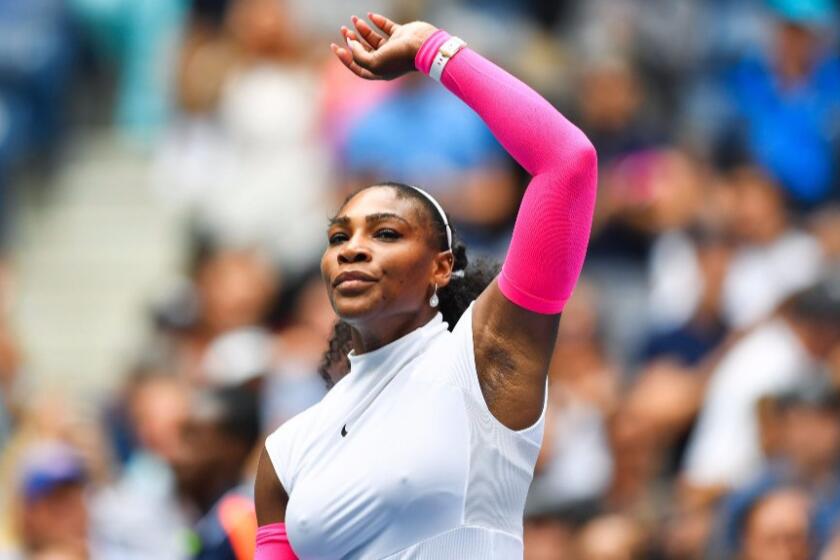 Serena Williams raises his arm after defeating Johanna Larsson of Sweden, 6-2, 6-1, at the U.S. Open.