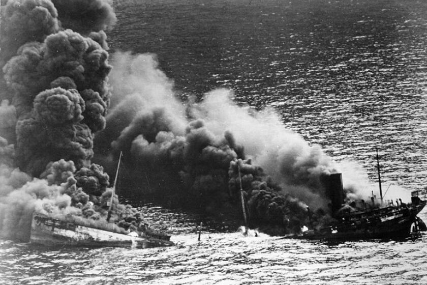 The USS Normandie goes down in flames on Feb. 9. 1942.  