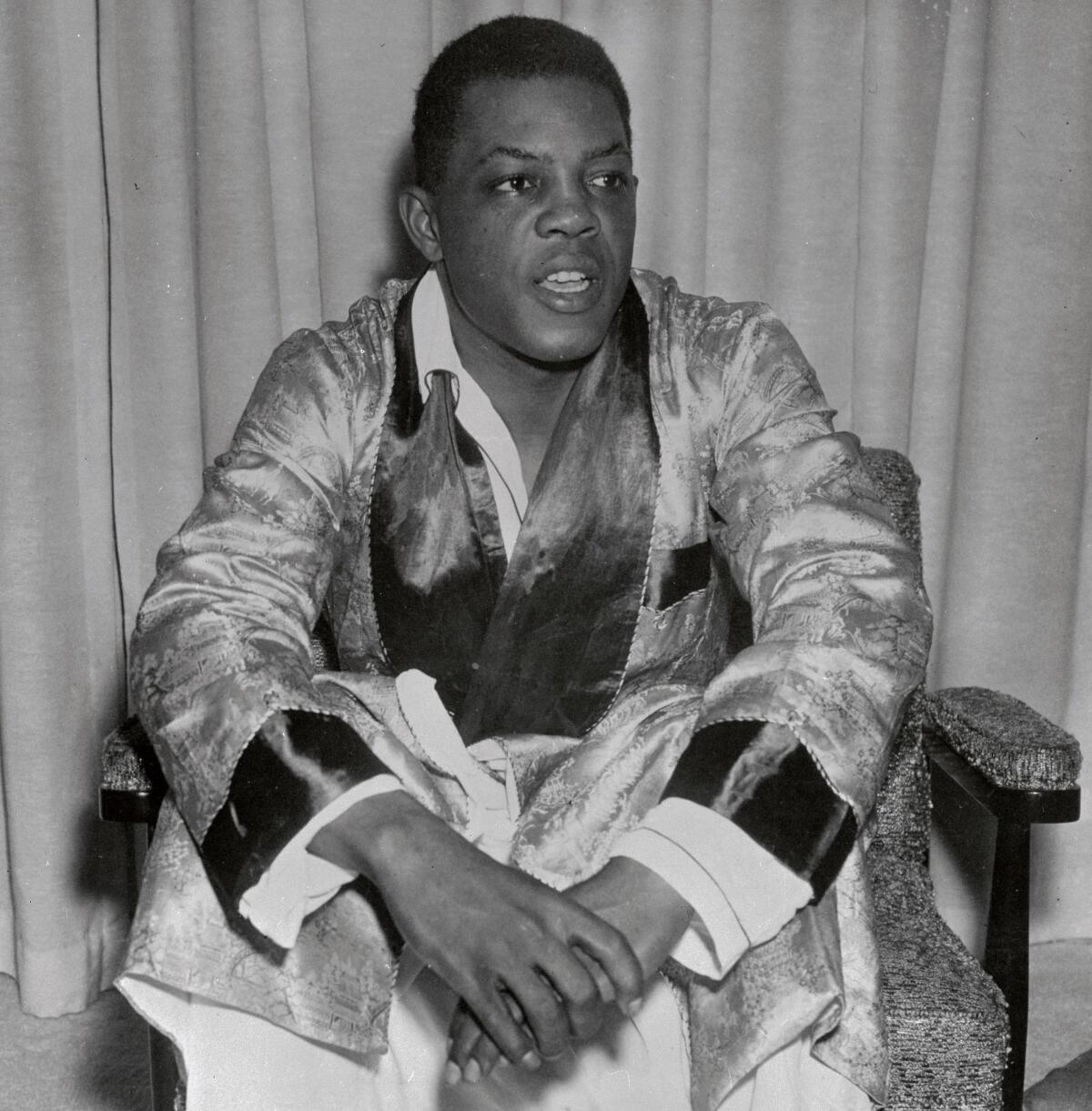 Willie Mays seated in 1957. 
