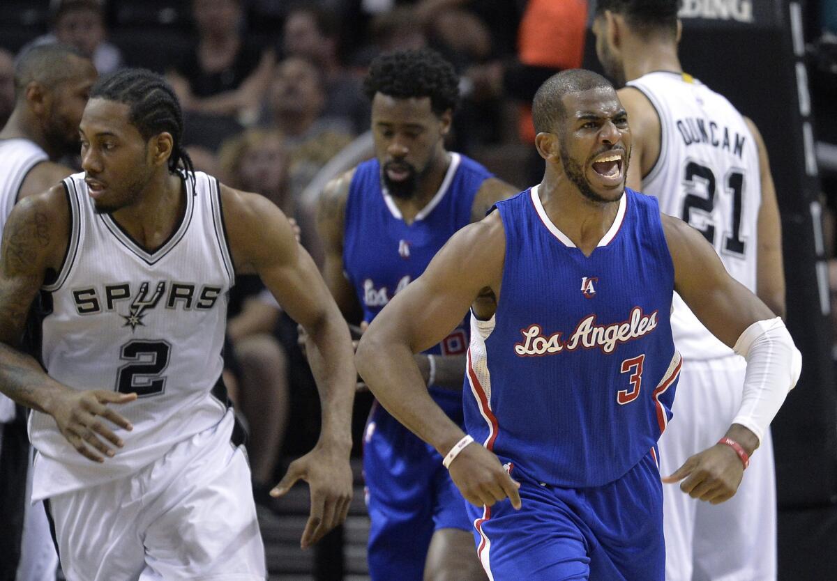 Clippers point guard Chris Paul reacts after scoring against the Spurs in the second half of Game 4 on Sunday afternoon in San Antonio.