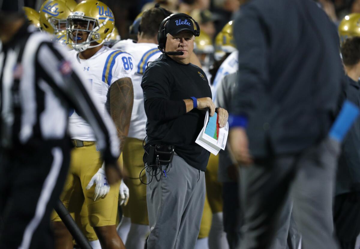 UCLA coach Chip Kelly watches during the first half of the team's NCAA college football game against Colorado.