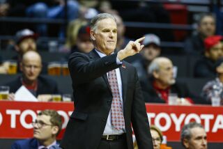 SAN DIEGO, March 3rd, 2018 | San Diego State vs Nevada men's college basketball at SDSU's Viejas Arena on Saturday, March 3rd, 2018. SDSU head coach Brian Dutcher motions from the sideline during the second half against Nevada. Photo by Chadd Cady