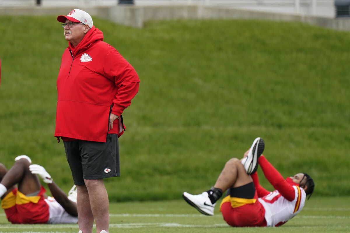 Kansas City Chiefs head coach Andy Reid watches an NFL football rookie minicamp Saturday, May 15, 2021, in Kansas City, Mo. (AP Photo/Charlie Riedel)