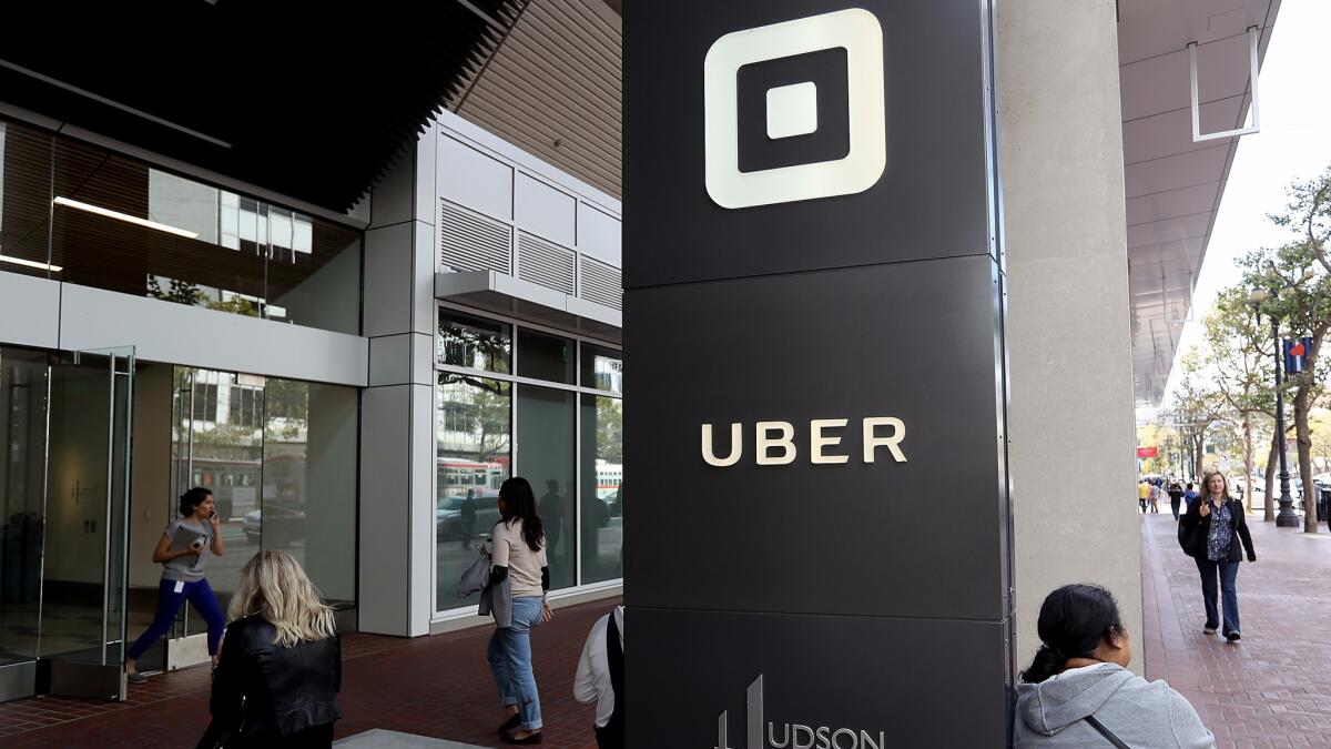 The logo of the ride-sharing service Uber in front of its headquarters in San Francisco.