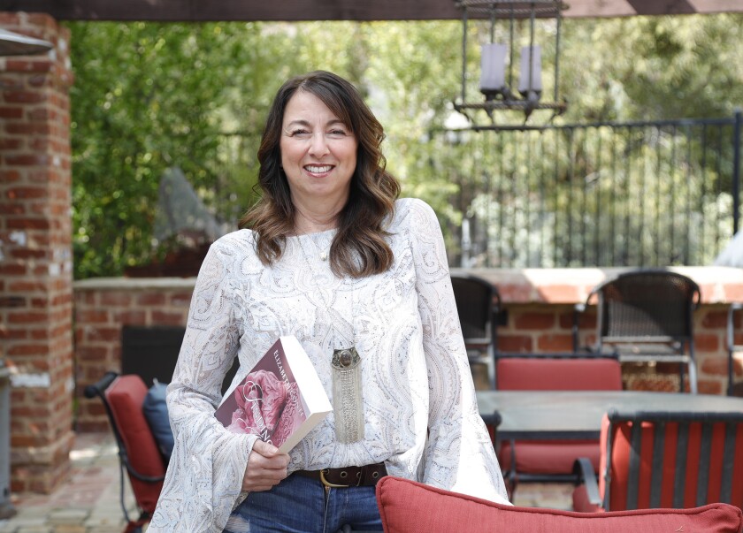 Elizabeth Conte with her first book, "Find Joan."