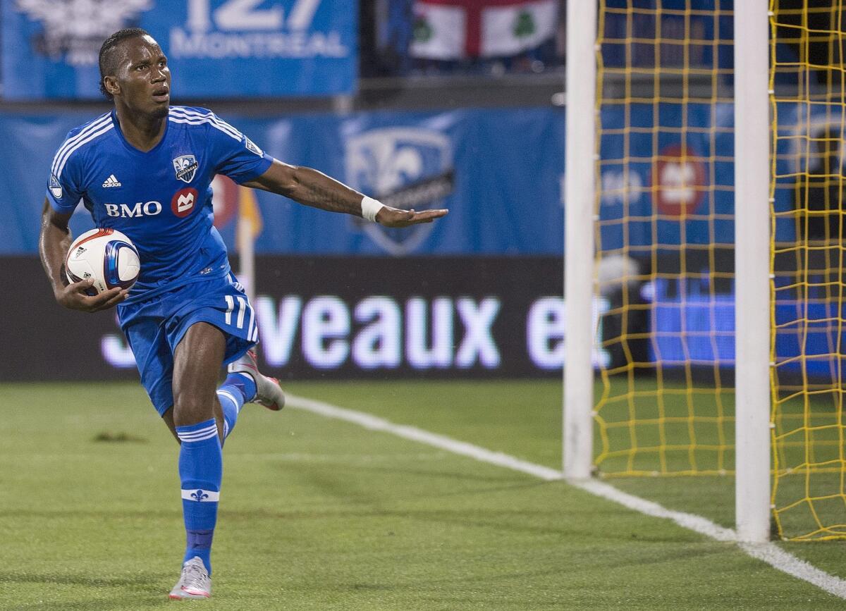Montreal Impact's Didier Drogba reacts after scoring against the Chicago Fire during second half of a MLS soccer game in Montreal, Saturday, Sept. 5, 2015. (Graham Hughes/The Canadian Press via AP) MANDATORY CREDIT