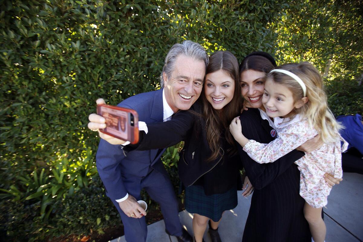 Bobby Shriver and his family pose for a selfie after he and his wife cast thier ballots in the November 2014 election in Santa Monica.