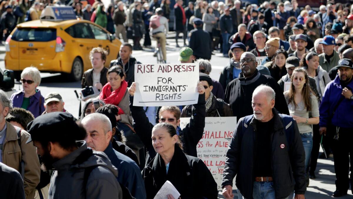 Immigration rights supporters circle the Immigration and Customs Enforcement building in New York on March 9.