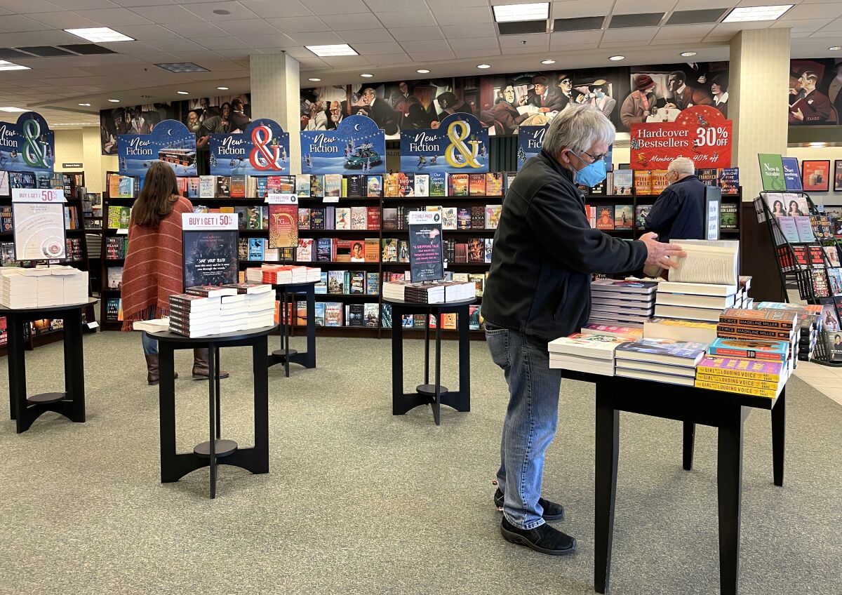 Customers shop for books at a Barnes & Noble store in Corte Madera, Calif.