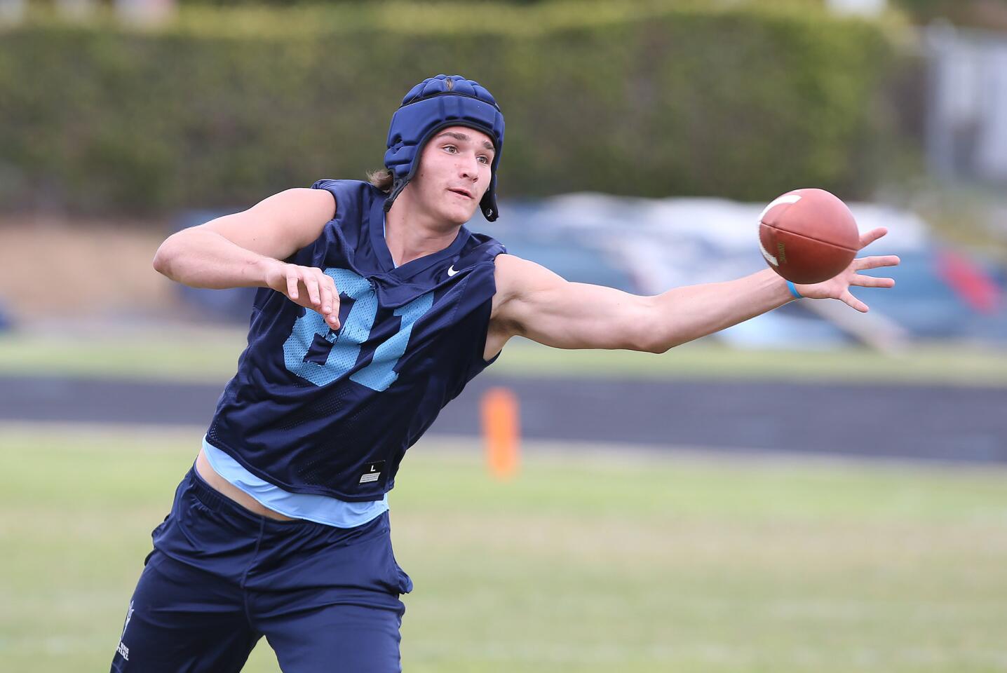 Tight end Mark Redman makes a catch during a spring football showcase at Corona del Mar High on Wednesday.