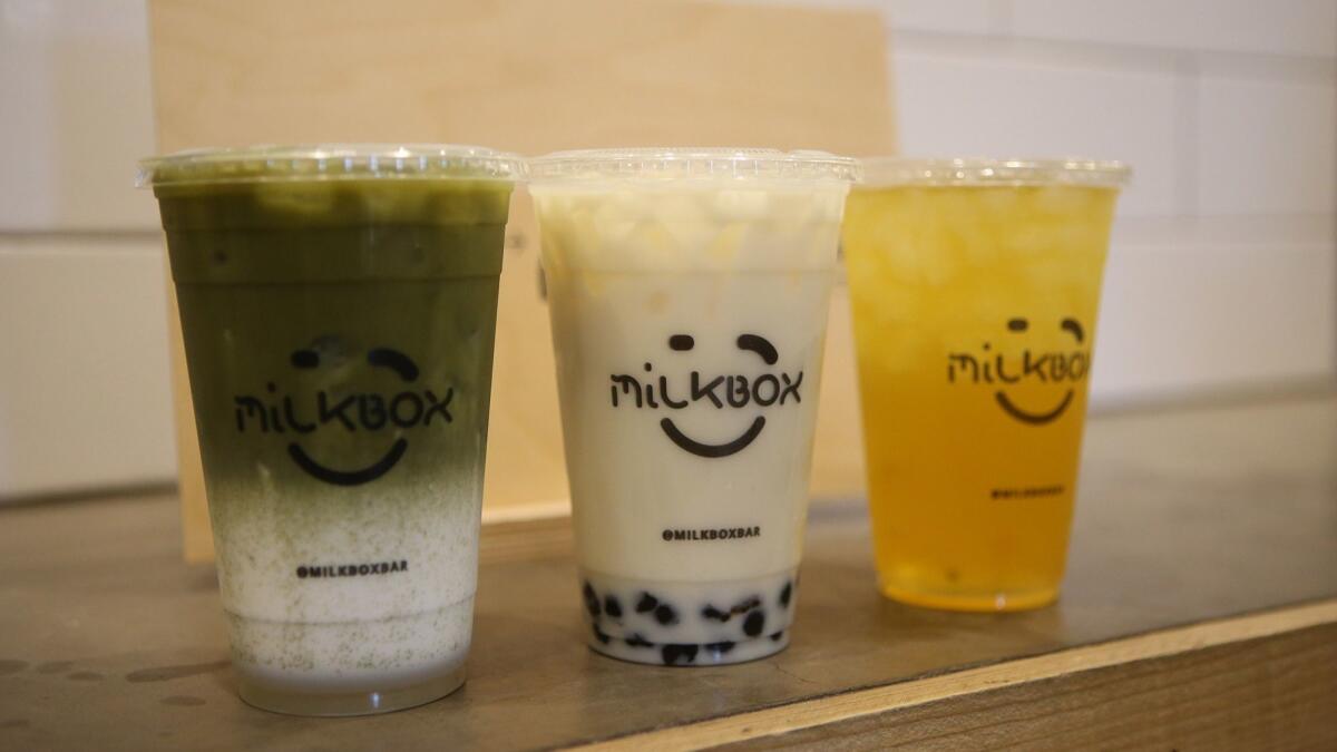 Milk Box beverages include matcha and jasmine milk teas and passion fruit iced tea, from left. The shop is in the District at Tustin Legacy.