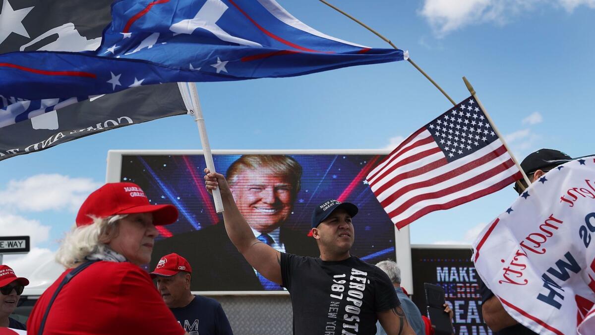 Supporters of President Trump line the streets near his Mar-a-Lago home in West Palm Beach, Fla., on March 4, 2017