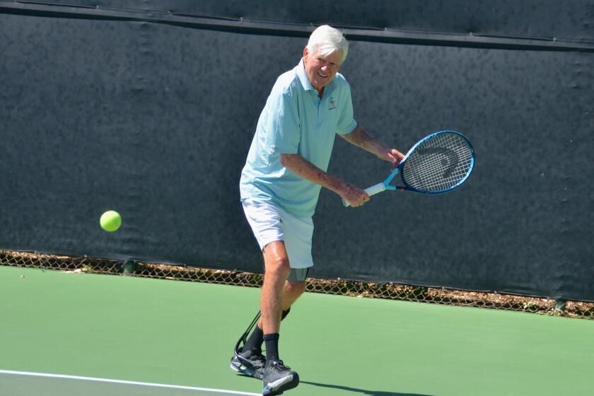 Larry Collins returns ball to opponent Monday at Palisades Tennis Club Newport Beach. Collins lost mobility in 2022 due to complications with a routine back surgery, but is now back on the courts.