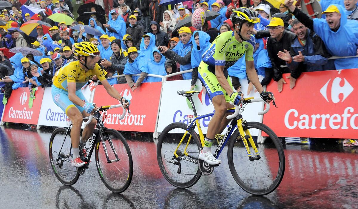 Alberto Contador of Spain begins to pull away from overall leader Vincenzo Nibali of Italy in the final stretch of the eighth stage of the Tour de France on Saturday in Gerardmer La Mauselaine.