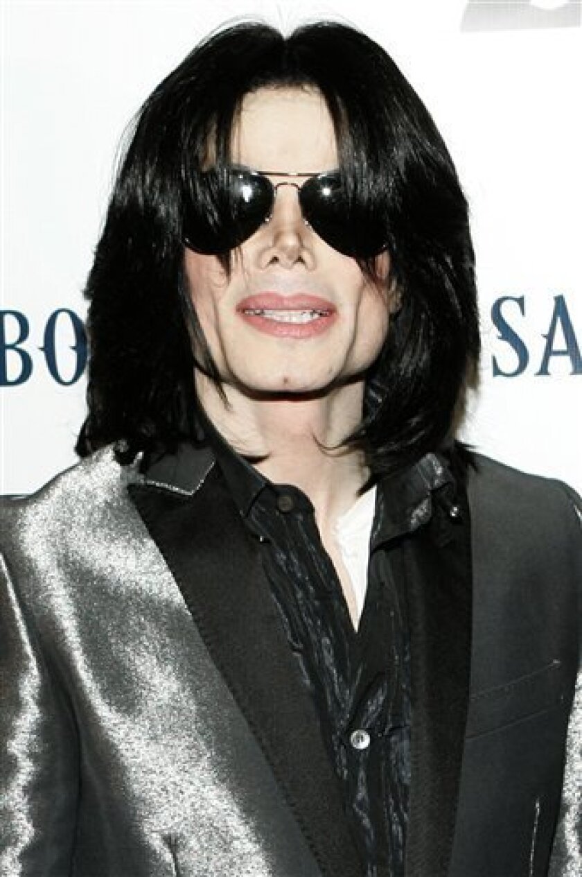 In this Nov. 8, 2007 file photo, pop star Michael Jackson poses on the red carpet during the RainbowPUSH Coalition Los Angeles 10th annual awards in Los Angeles. Representatives for the king of Bahrain's son say he is suing pop star Michael Jackson for $7 million. The Bell Pottinger Group says Sheik Abdulla bin Hamad Al Khalifa has filed a breach-of-contract case against the troubled singer at London's Royal Courts of Justice. The suit is to be heard Monday, Nov. 17, 2008. In 2006, Jackson announced he would put out a new album for Khalifa's record label 2 Seas Records. Media reports say Khalifa is arguing that the promised work was never delivered. (AP Photo/Danny Moloshok, file)