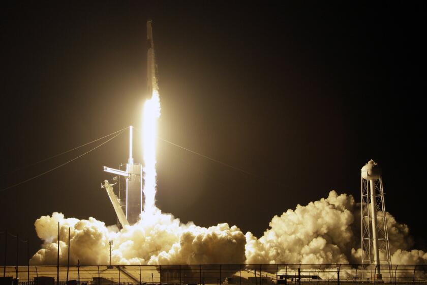 A SpaceX Falcon 9 rocket with a demo Crew Dragon spacecraft lifts off from pad 39A on an uncrewed test flight to the International Space Station at the Kennedy Space Center in Cape Canaveral, Fla., Saturday, March 2, 2019. (AP Photo/Terry Renna)