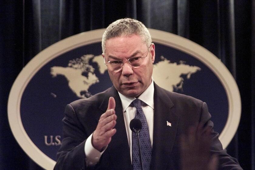 FILE - In this Monday, Sept. 17, 2001 file photo, Secretary of State Colin Powell speaks during a news conference at the State Department in Washington, discussing the diplomatic aspects of the previous week's terrorist attacks. (AP Photo/Hillery Smith Garrison, File)