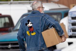 ANAHEIM, CA - OCTOBER 27: Volunteers distribute donated food among Disney workers at a monthly food bank at Workers United Local 50 on Friday, Oct. 27, 2023 in Anaheim, CA. (Irfan Khan / Los Angeles Times)