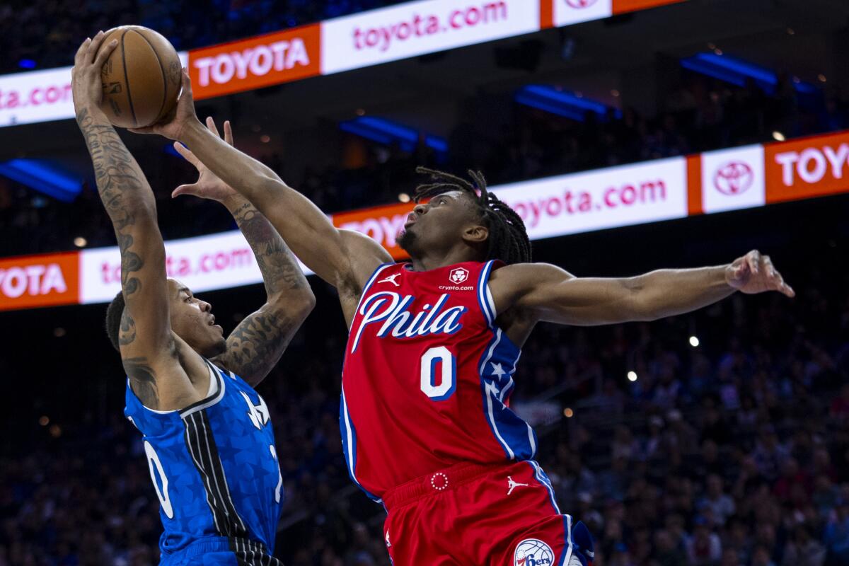 Joel Embiid returns from injury scare, scores 32 as 76ers beat Magic 125-113  - The San Diego Union-Tribune