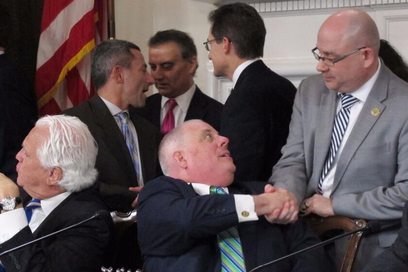 Maryland Gov. Larry Hogan, a Republican, shakes hands with Del. David Fraser-Hidalgo on Tuesday, April 4, 2017 in Annapolis, Maryland, after signing a bill to ban the hydraulic drilling technique known as fracking in the state. Fraser-Hidalgo, a Democrat, sponsored the bill. Maryland is the first state where a legislature has voted to bar the practice that actually has natural gas reserves. (AP Photo/Brian Witte)