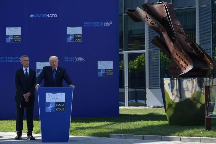President Trump speaks next to NATO Secretary General Jens Stoltenberg during an unveiling ceremony at a NATO leaders meeting in Brussels, on May 25, 2017.