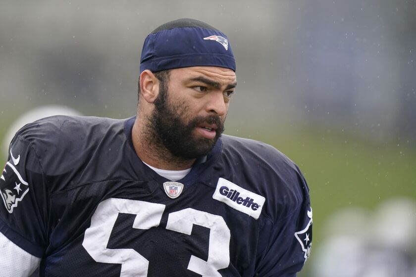 New England Patriots middle linebacker Kyle Van Noy warms up during an NFL football practice, Wednesday, Dec. 22, 2021, in Foxborough, Mass. (AP Photo/Steven Senne)