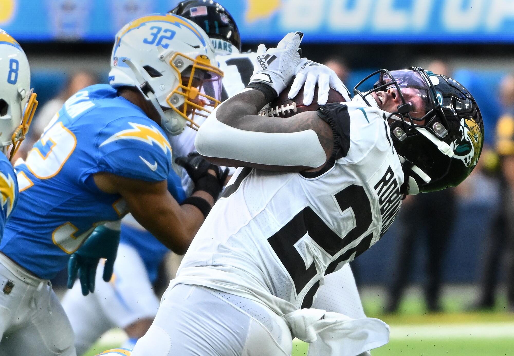 Jaguars running back James Robinson picks up yards against the Chargers in the second quarter.