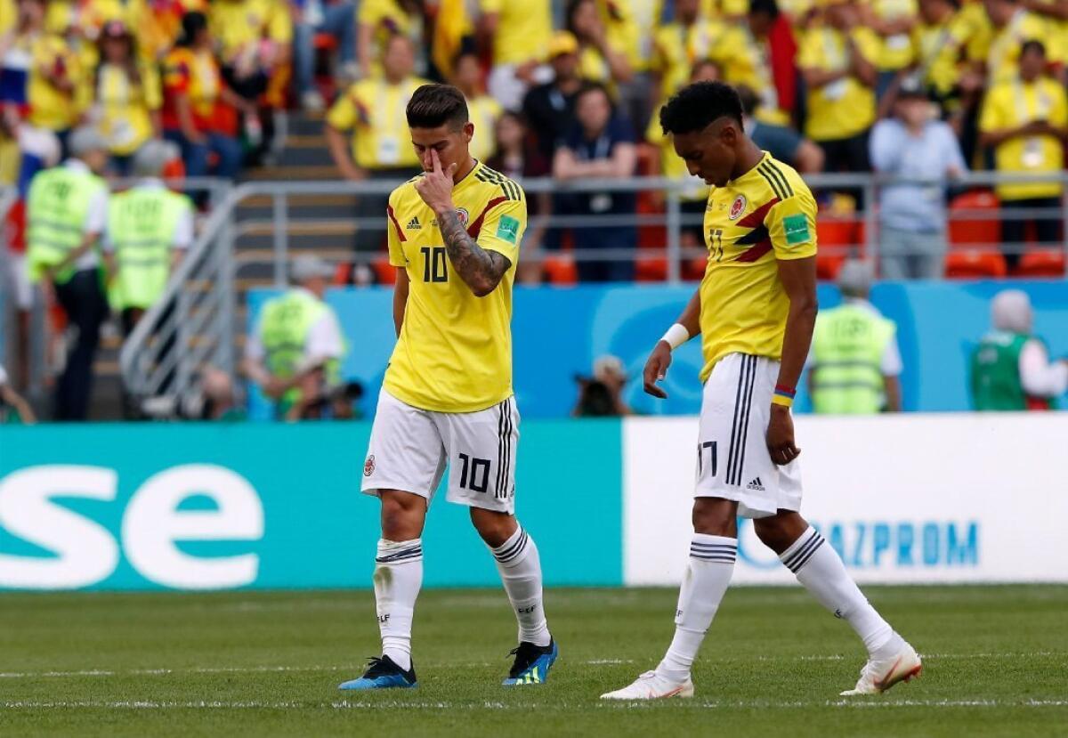 Colombia's James Rodriguez, left, and Johan Mojica react after losing a group H match against Japan in Saransk on June 19.