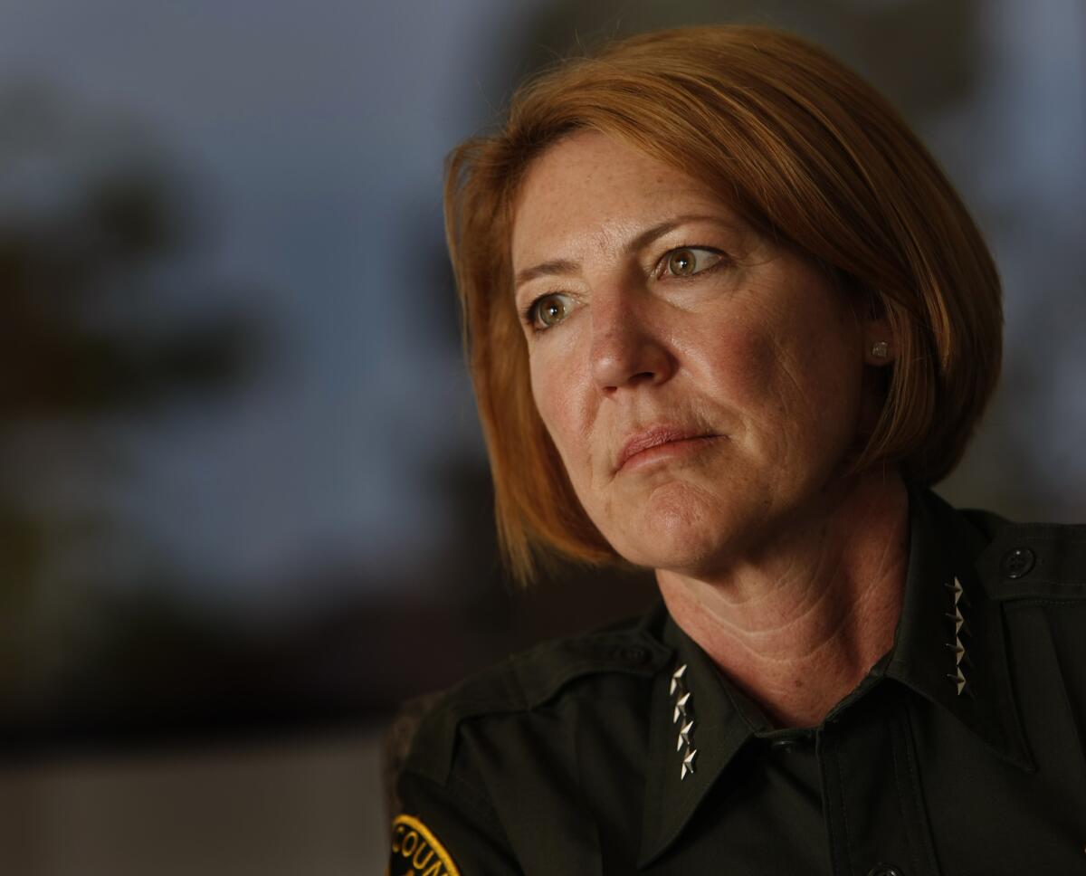 Orange County Sheriff Sandra Hutchens says she has a delicate balancing act on her hands.