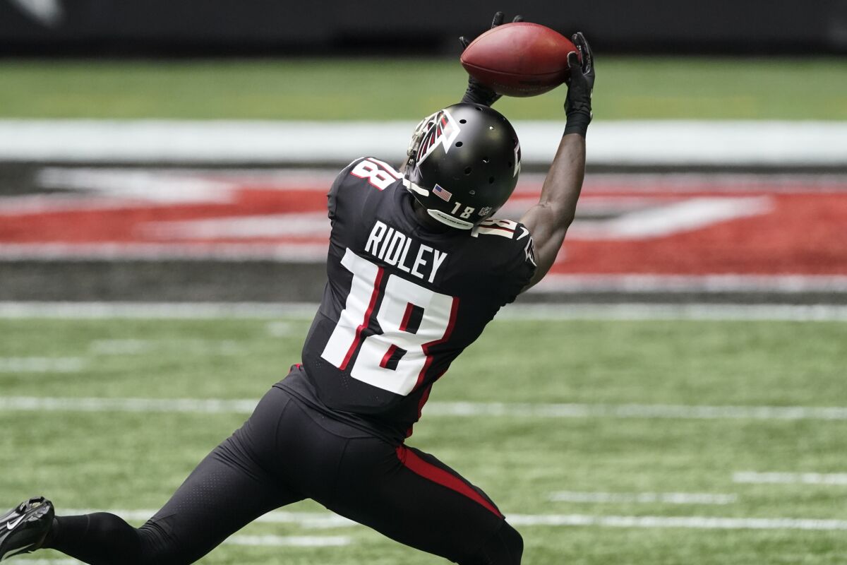 Atlanta Falcons wide receiver Calvin Ridley (18) makes a catch against the Chicago Bears during the first half of an NFL football game, Sunday, Sept. 27, 2020, in Atlanta. (AP Photo/John Bazemore)